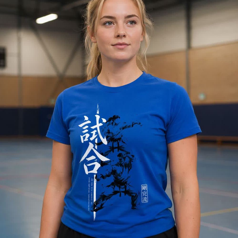 A competitor wearing the royal blue 2026 National Champs tee in a sports hall.